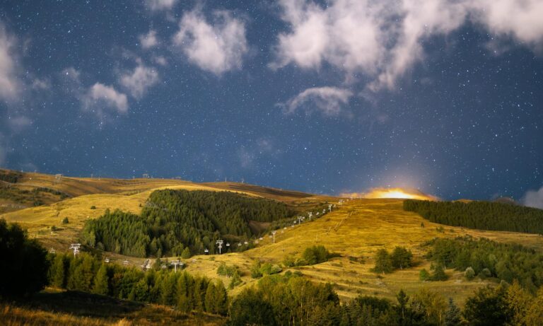 Stunning night landscape of a ski resort in France under a starry sky. Perfect for travel inspiration.