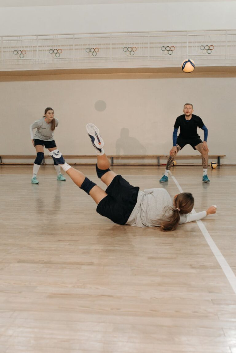 Intense indoor volleyball match showcasing players in action.