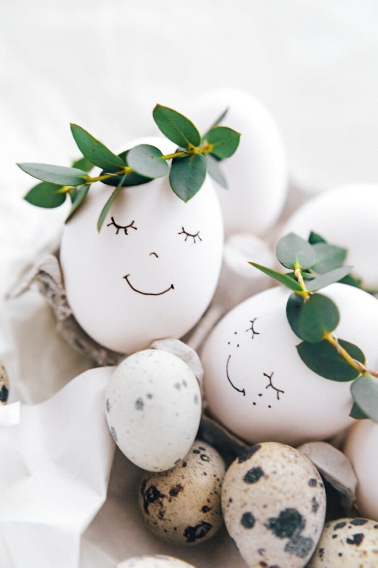 Decorative Easter eggs with smiling faces and leaf crowns, perfect for festive celebrations.