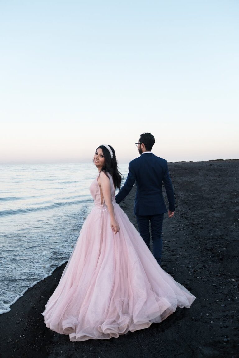 Couple celebrating their wedding by the serene seashore of La Paz, B.C.S., México during twilight.