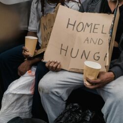 A poignant image capturing the realities of homelessness on public transportation.