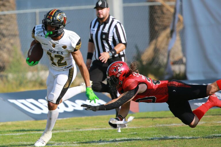 Intense moment as players compete fiercely during an American football match on the field.