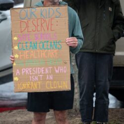 Outdoor protest in South Kingstown, Rhode Island, advocating for safe schools and healthcare.