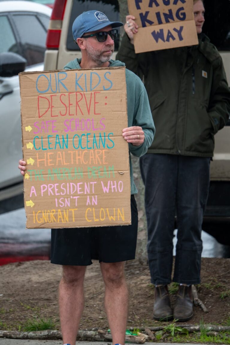 Outdoor protest in South Kingstown, Rhode Island, advocating for safe schools and healthcare.
