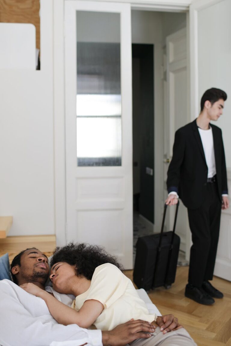 A tense scene of relationship conflict with a couple and a departing person.