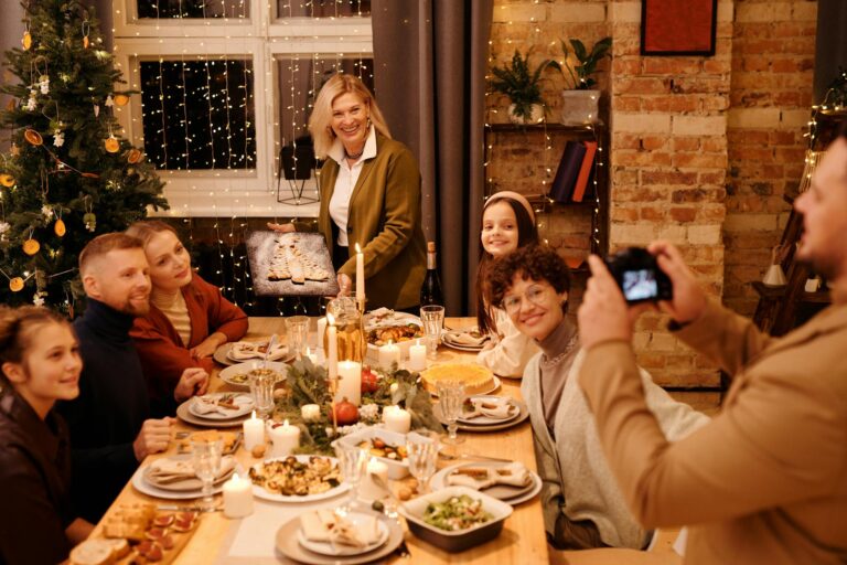 A happy family gathering around a festive Christmas dinner table, capturing joyful moments.