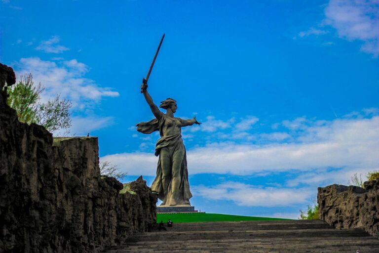 Stunning view of the Motherland Calls statue in Volgograd, Russia under a blue sky.