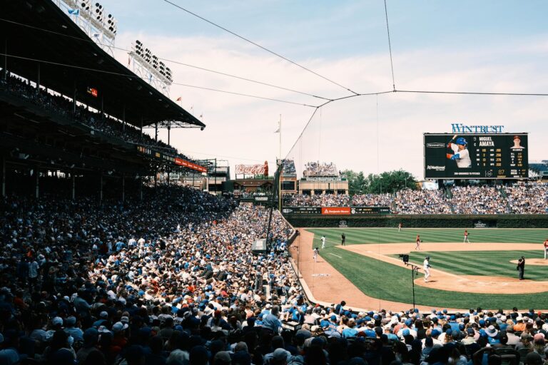 Panoramic view of a bustling baseball game at Wrigley Field, Chicago, capturing the vibrant atmosphere.