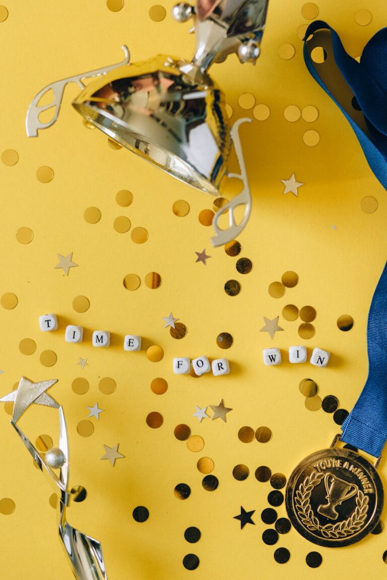 Gold trophy and medal with celebratory confetti and motivational message.