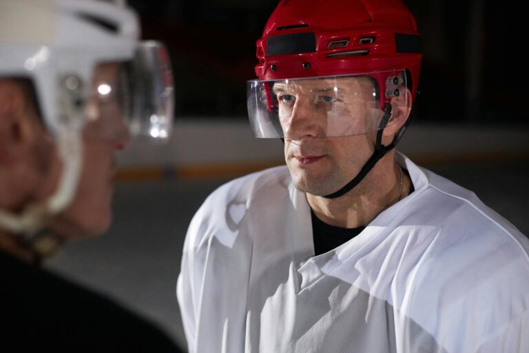 Close-up of two ice hockey players in a serious moment on the rink.