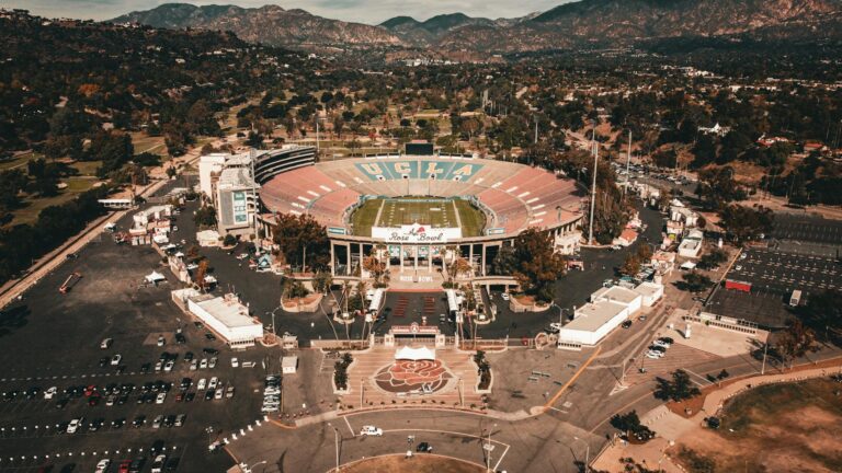 Stunning aerial view of the historic Rose Bowl Stadium in Pasadena, showing its vibrant surroundings.