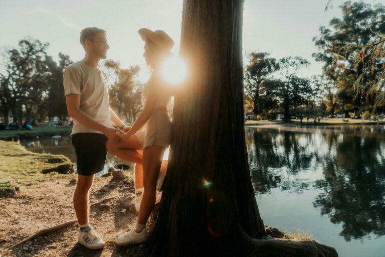 A couple shares a romantic moment by the lakeside in Buenos Aires, Argentina.