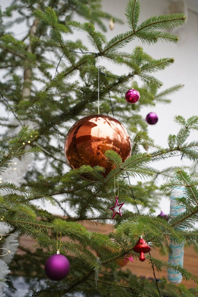 Festive Christmas tree adorned with colorful ornaments in Çanakkale, Türkiye.