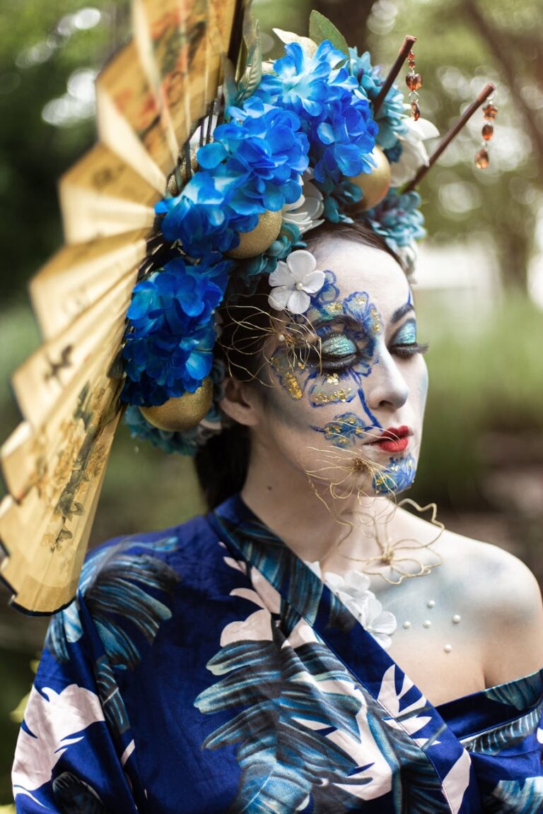 Beautiful geisha-inspired costume with intricate face paint and floral headdress.