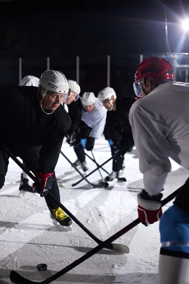 Action-packed ice hockey game with players facing off on a rink. Intense sport competition.