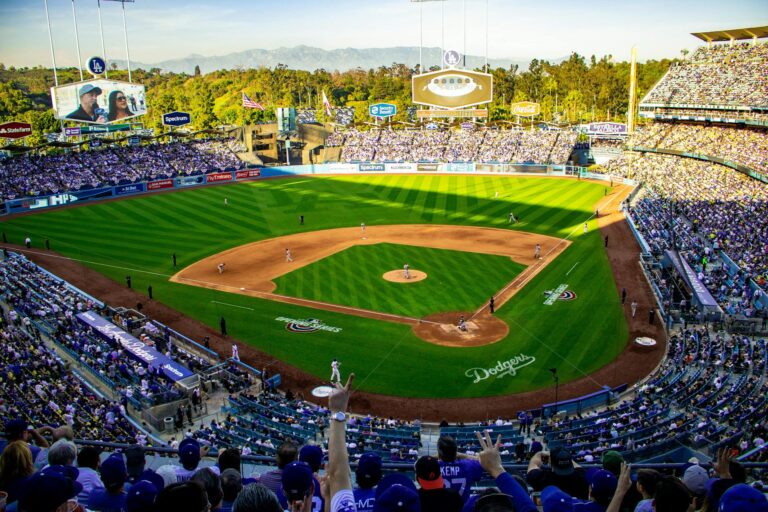 A lively baseball game at Los Angeles' iconic Dodger Stadium, capturing the vibrant atmosphere and full crowd.