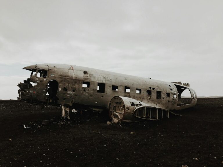 Abandoned DC-3 airplane remains on a desolate Icelandic landscape, creating a moody scene.