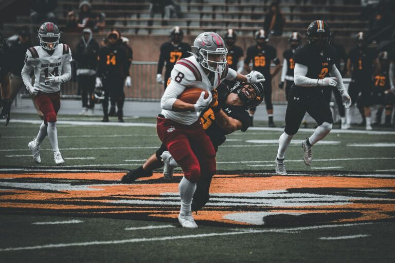 Intense high school football game showcasing action and teamwork on the field.