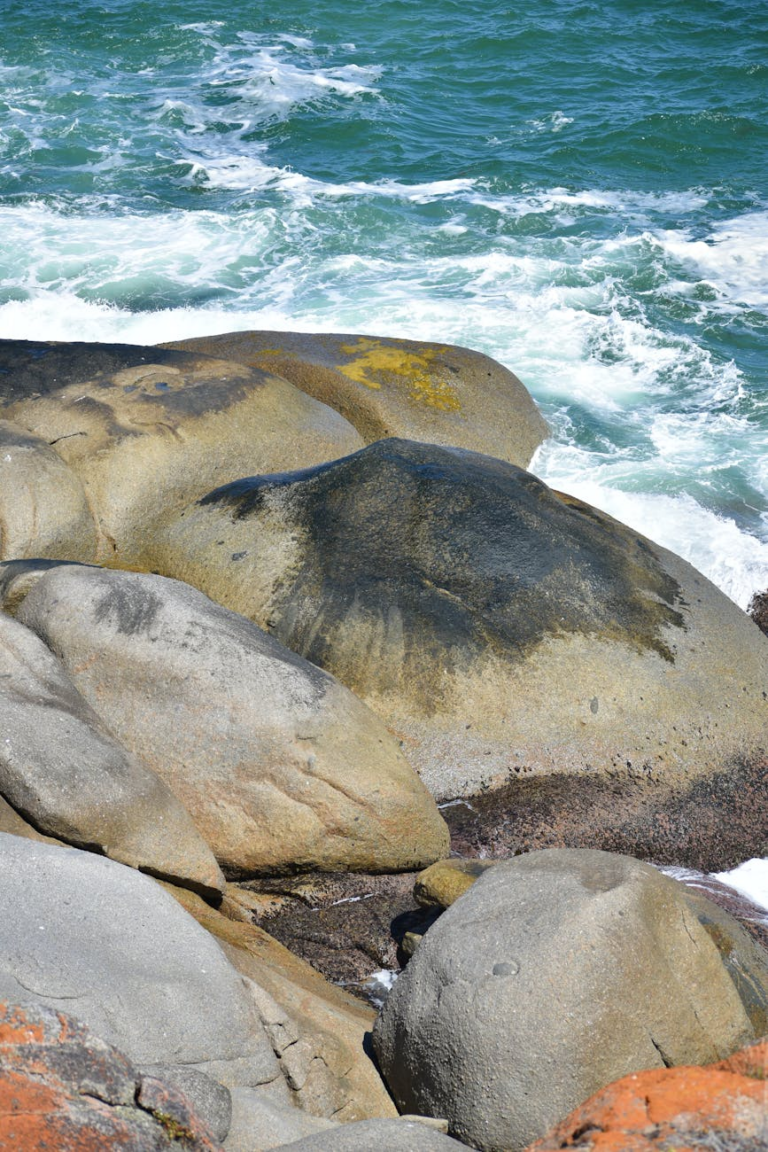 Beautiful coastal rocks with ocean waves at Victor Harbor, SA, Australia.